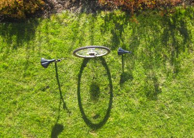 installation of bicycle parts on a green yard
